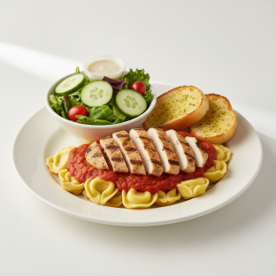 Tortellini Marinara With Grilled Chicken With House Salad and Garlic Bread Tortellini Marinara With Grilled Chicken With House Salad and Garlic Bread