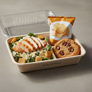 Chicken Caesar Salad with a Bag of Chips and a Chocolate Chip Cookie