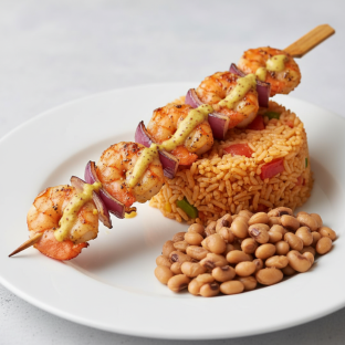 Brochette Shrimp with Jollof Rice and Black-Eyed Peas
