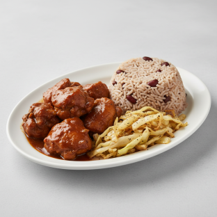 Brown Stewed Chicken, Rice and Peas, and Fried Cabbage