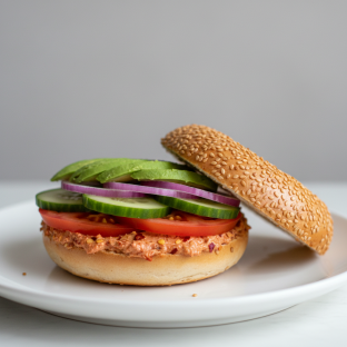Garlic Chili Crisp Cream Cheese, Veggie and Avocado Sandwich - Sesame Bagel Garlic Chili Crisp Cream Cheese, Veggie and Avocado Sandwich - Sesame Bagel