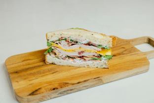 Gluten-Free Turkey and Bacon Club Sandwich With Potato Chips and Cowboy Cookie