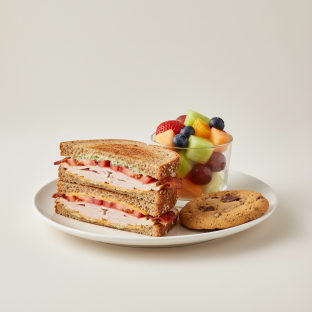Turkey and Bacon Club Sandwich With Fruit Cup and Chocolate Chip Cookie Turkey and Bacon Club Sandwich With Fruit Cup and Chocolate Chip Cookie