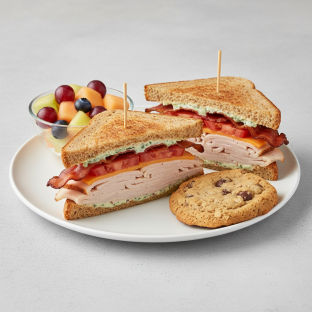 Gluten-Free Turkey and Bacon Club Sandwich With Fruit Cup and Cowboy Cookie Gluten-Free Turkey and Bacon Club Sandwich With Fruit Cup and Cowboy Cookie