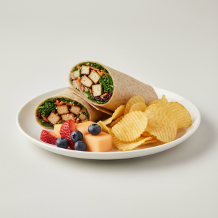 Tokyo Supergreens with Organic Sesame Tofu Wrap with Chips and Fruit Tokyo Supergreens with Organic Sesame Tofu Wrap with Chips and Fruit