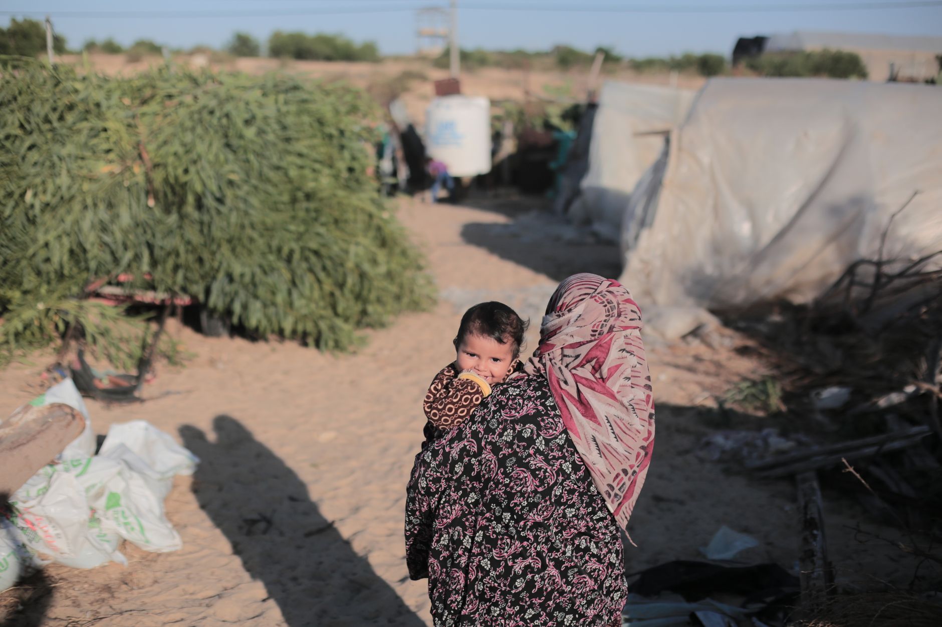 Photos: Gaza mothers endure endless lines as famine fears persist