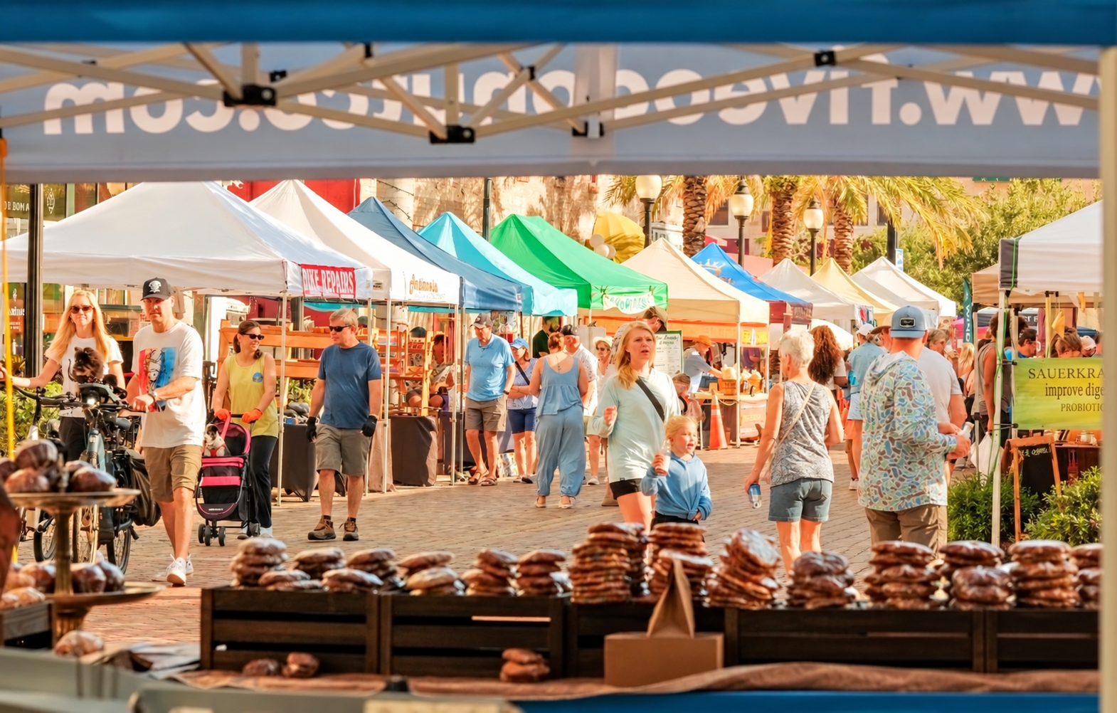 Vendor stalls and shoppers at the Sarasota Farmers Market