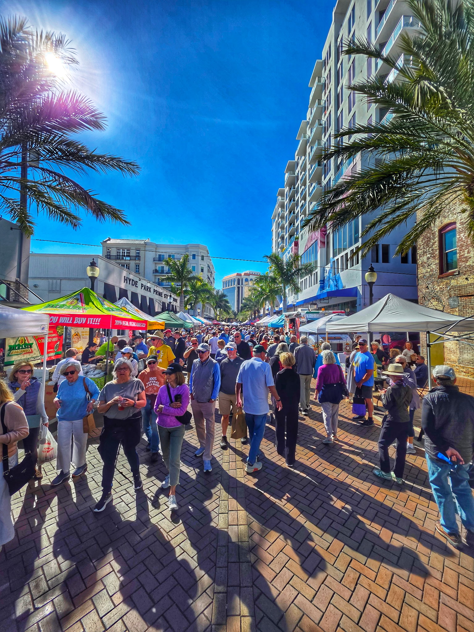 Crowds walking through the Sarasota Farmers Market downtown