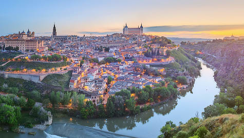 Panoramic view of ancient city and alcazar on a hill over the Tagus river, Castilla la Mancha, Toledo, Spain.