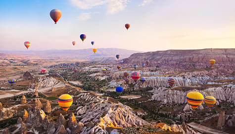 Hot air balloons in flight over Cappadocia, Turkey