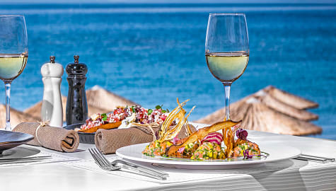 Beach side dining with Greek cuisine in Santorini