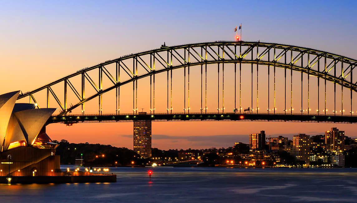 Sydney Opera House, Harbour Bridge, and Harbour in evening