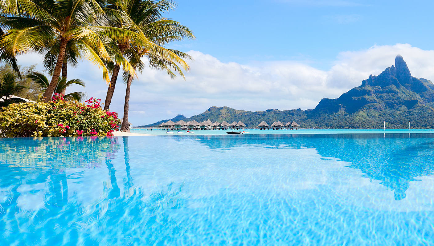 Resort pool with bungalows and Mount Otemanu in Bora Bora, French Polynesia