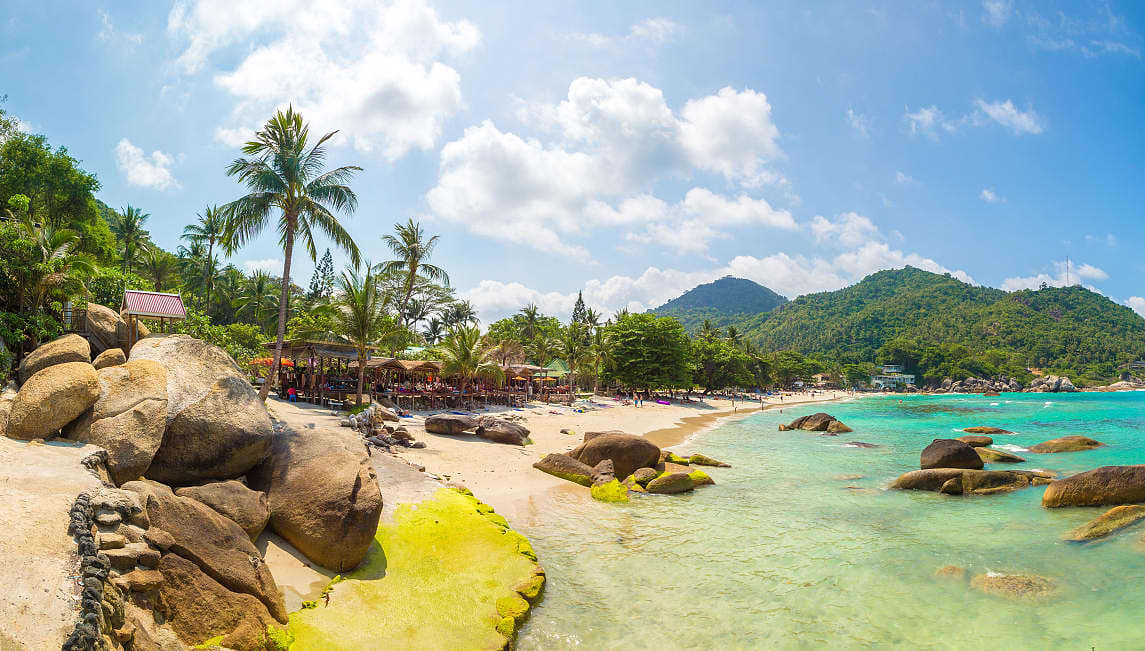 Thailand coastline with light blue waters and white sand