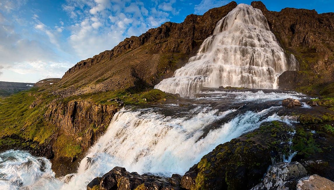 Couple at Dynjandi Waterfalls in the the Westfjords, Iceland