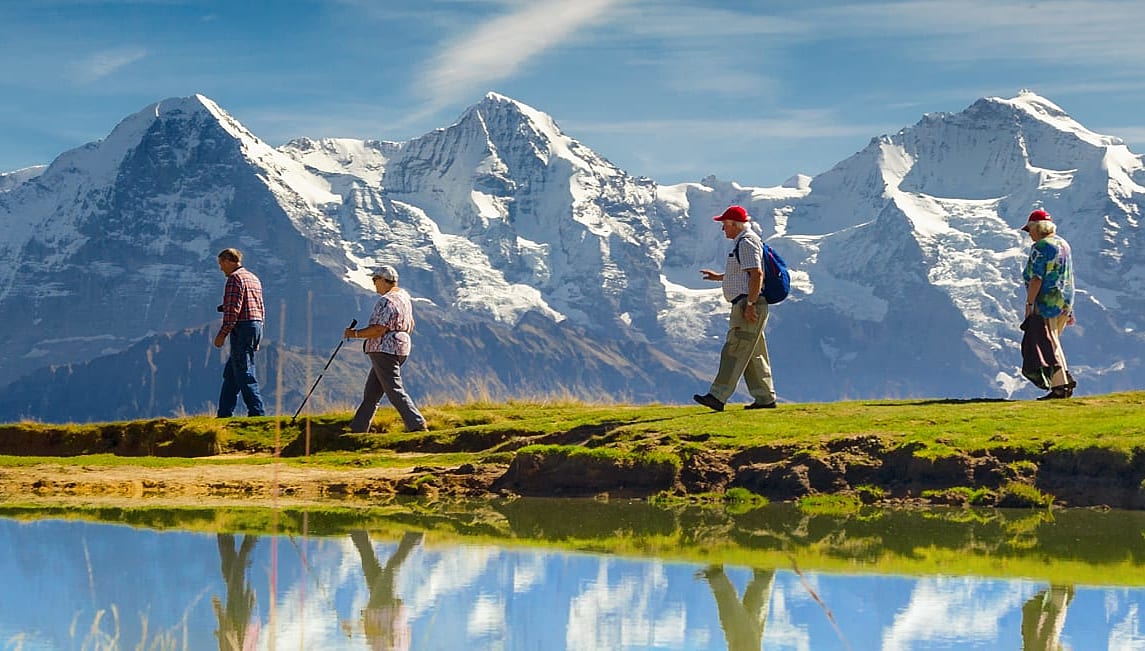 Senior travelers hiking in Bernese Oberland, Switzerland