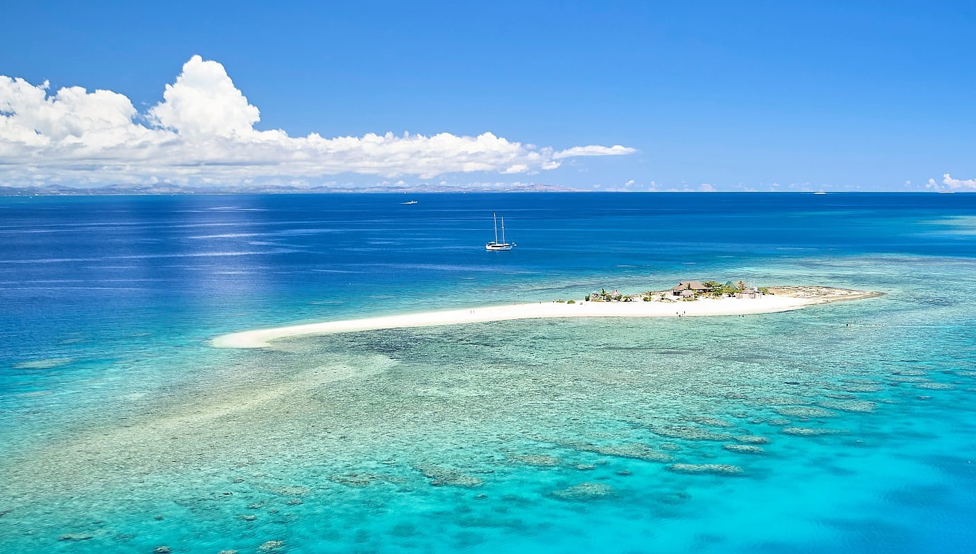 Romantic remote island with coral reef in the Fijian Island