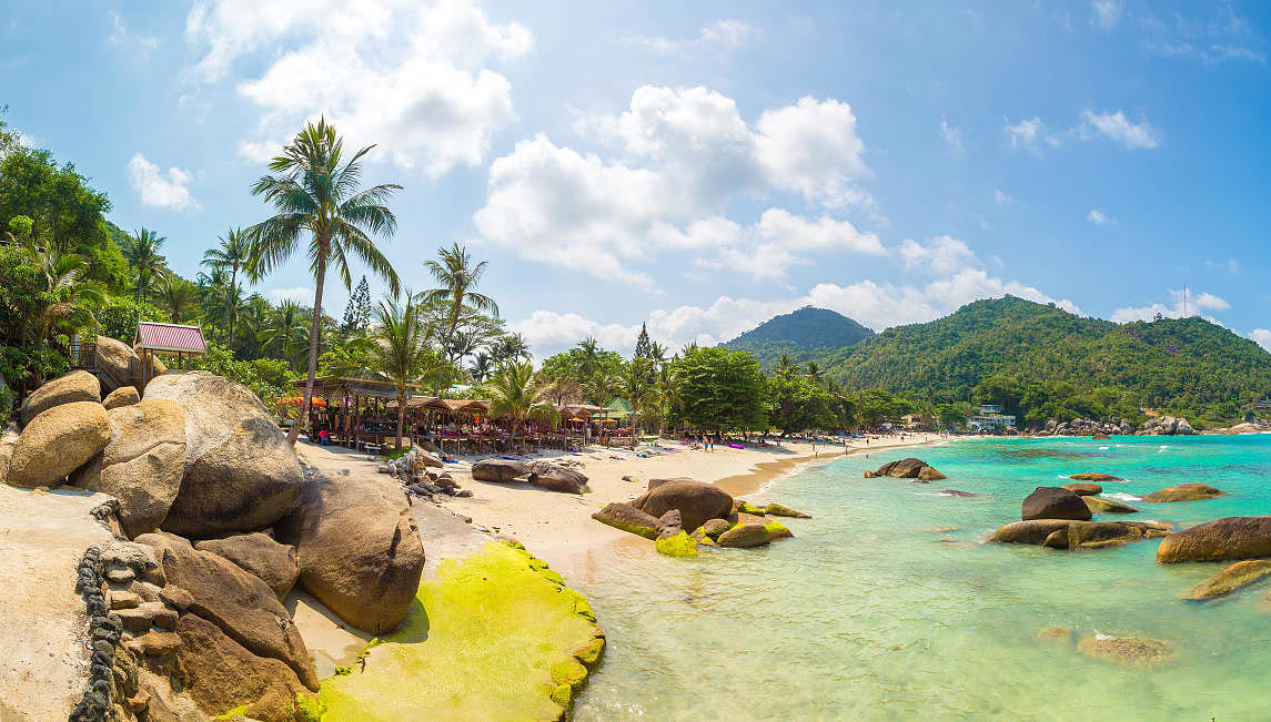 Thailand coastline with light blue waters and white sand