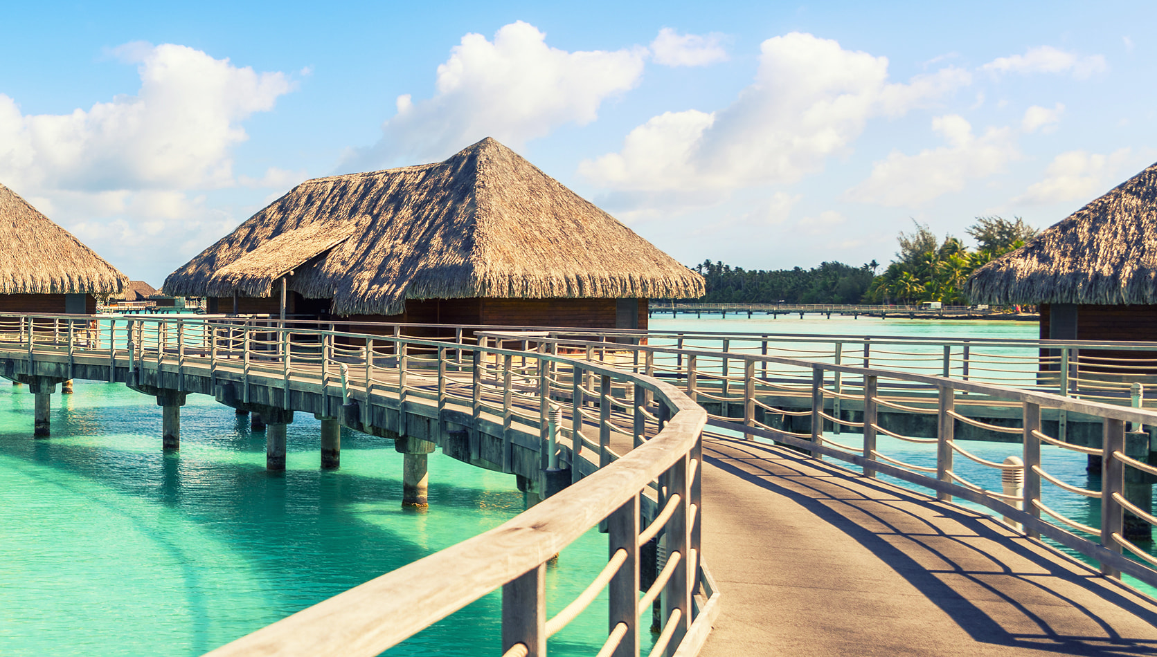 Overwater bungalows on a Tahiti vacation