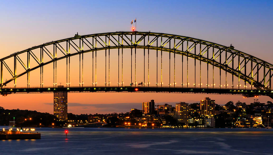 Sydney Opera House, Harbour Bridge, and Harbour in evening
