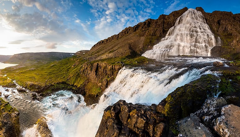 Couple at Dynjandi Waterfalls in the the Westfjords, Iceland