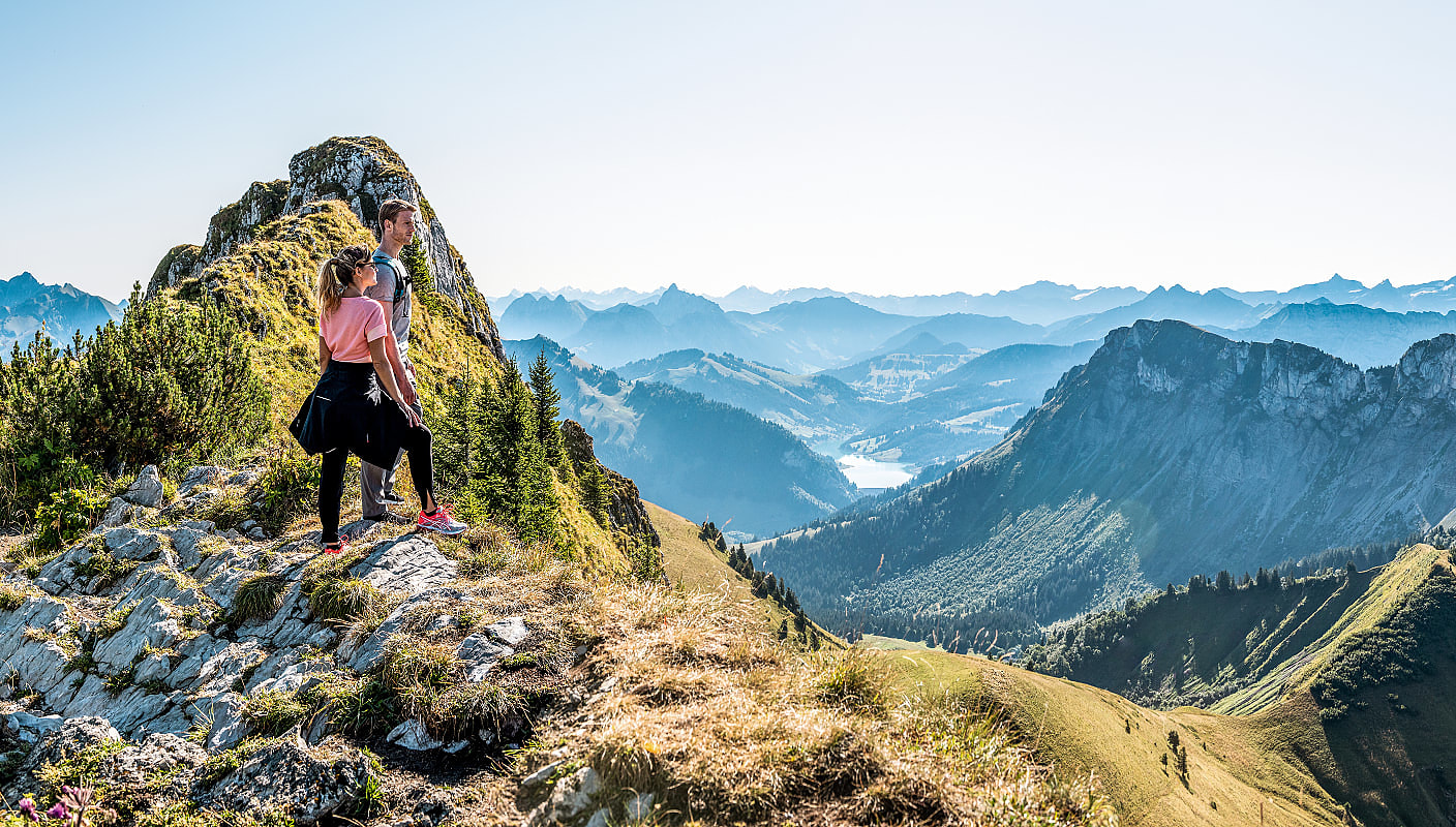 Couple hiking Rochers de Naye in Switzerland