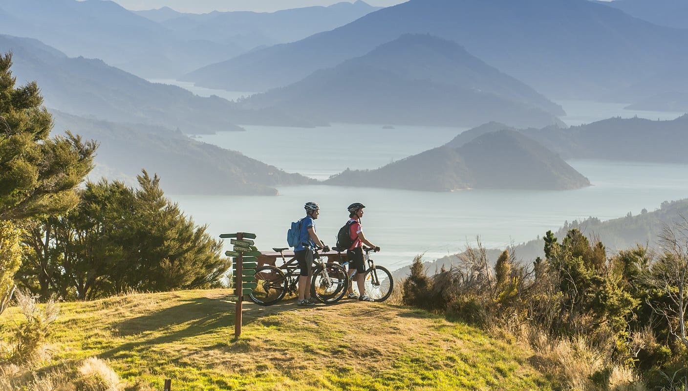 Couple biking in the Marlborough Sounds, New Zealand