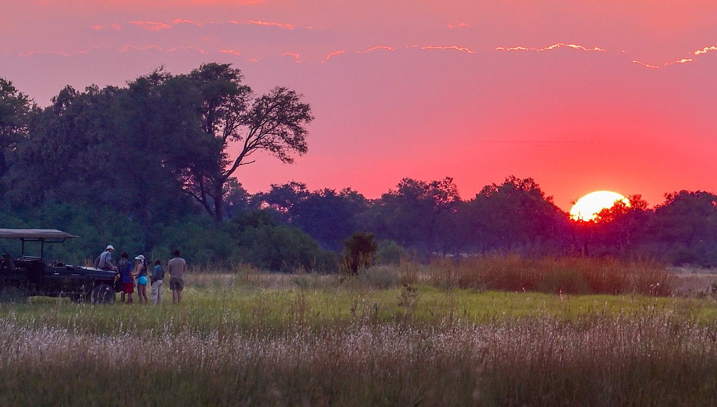 Family on safari in the Okavango Delta, Botswana