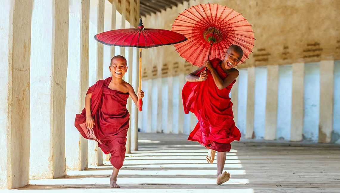 Myanmar Tour - Young monks running at temple in Bagan