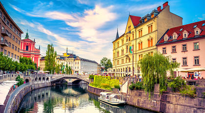 A canal weaving through old town Ljubljana.