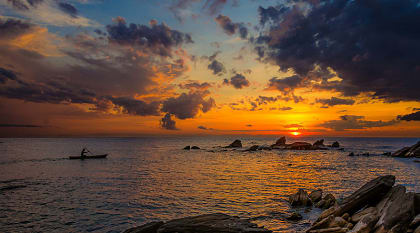 Canoeing Lake Malawi at sunset