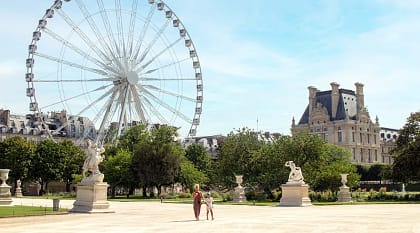 Mother and daughter walk in Paris Tuileries Garden, France