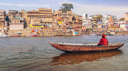 Sadhu on a wooden boat on river Ganges, IndiaSadhu on a wooden boat on river Ganges, IndiaSadhu on a wooden boat on river Ganges, IndiaSadhu on a wooden boat on river Ganges, India