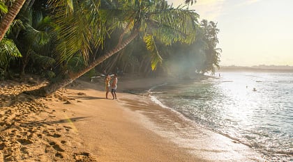 Couple at paradise beach of Manzanillo Park in Costa Rica