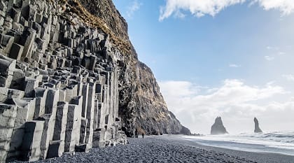 The black sand beach of Reynisfjara and the mount Reynisfjall, Iceland