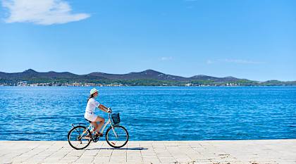 Woman cycling in Croatia 