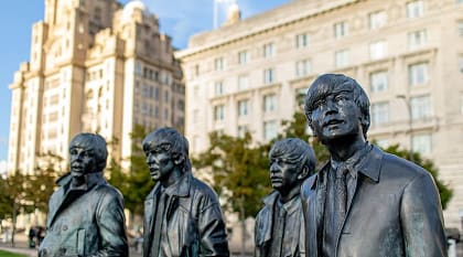 The Beatles Statues in Liverpool, UK. Photo courtesy of: Visit Liverpool Lifelike bronze statues of The Beatles on Liverpool’s waterfront promenade.