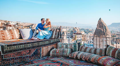 Couple in Cappadocia at sunrise in Turkey.