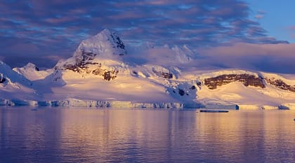 Mountain illuminated by sunset in Antarctica