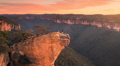 Hanging Rock in the Blue Mountains. Photo courtesy of Tourism Australia Hiker at Hanging Rock in the Blue Mountains, Australia