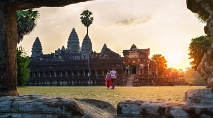 Couple walking thru Angkor Wat in Siem Reap, Cambodia