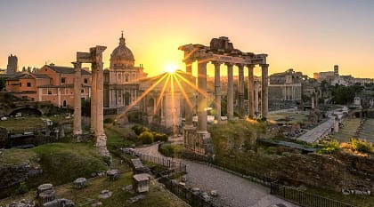Sun rising over Roman ruins in Italy