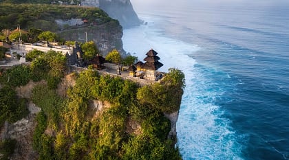 Cliffside Pura Luhur Uluwatu Temple at sunrise in Bali, Indonesia Cliffside Pura Luhur Uluwatu Temple at sunrise in Bali, Indonesia
