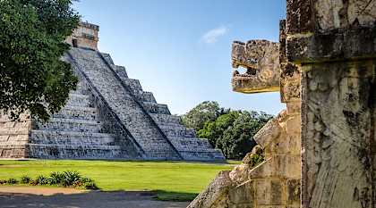 Jaguar head and pyramid of Kukulkan - Chichen Itza, Mexico Jaguar head and pyramid of Kukulkan - Chichen Itza, Mexico
