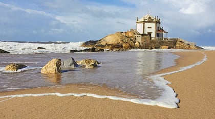 Capela do Senhor da Pedra, a small church on the shore, Porto, Portugal