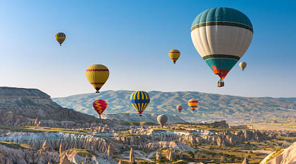 Hot air balloon floating above Cappadocia, Turkey.