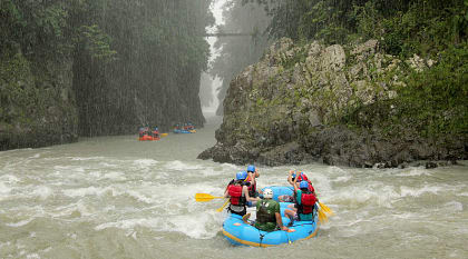 Rafting down the mountain river along the stunning waterfalls