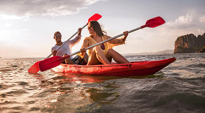 mmersive Getaway Vacation to Thailand for Couples Happy couple kayaking in Thailand
