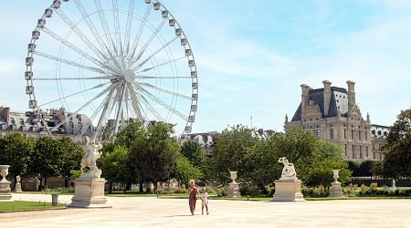 Mother and daughter walk in Paris Tuileries Garden, France