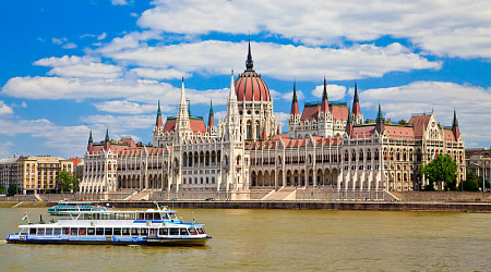 View of the Parliament with boat in Budapest, Hungary